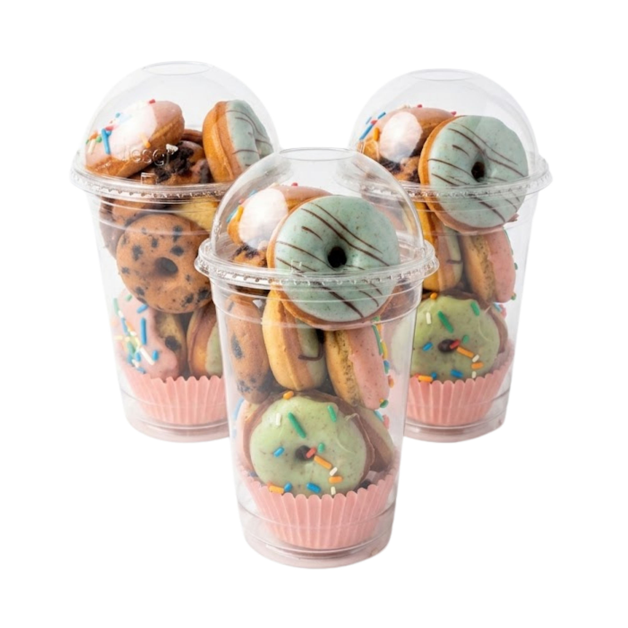 Tres vasos BRUMA rebosantes de mini donas recién hechas y glaseadas